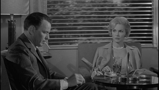 Eugenie Rose (Janet Leigh) watched Marco try to light a cigarette in the club car in John Frankenheimer's The Manchurian Candidate (1962)