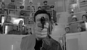 Raymond's conditioning is tested before an appreciative audience in John Frankenheimer's The Manchurian Candidate (1962)