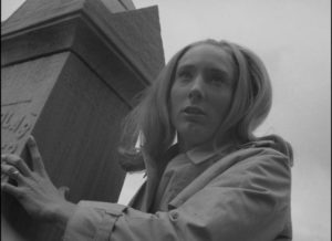 The zombie apocalypse begins: Barbra (Judith O'Dea) watches her brother being attacked in the graveyard in George A. Romero's Night of the Living Dead (1968)