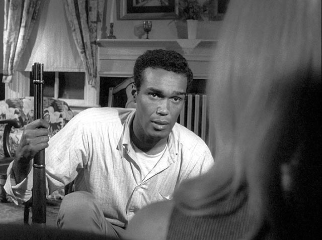 Ben (Duane Jones) tries to communicate with an almost catatonic Barbra (Judith O'Dea) in George A., Romero's Night of the Living Dead (1968)