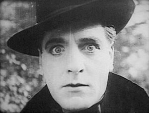 Louis Willoughby as Isoldi Keene, a sinister Mormon Elder with hypnotic powers in Trapped By the Mormons (1922)