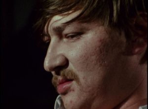 Baal (Rainer Werner Fassbinder) sneers at the world with contempt in Volker Schlondorff's Baal (1970)