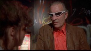 Christopher Lee tries unsuccessfully to hide behind his shades in a supporting role in Philippe Mora's Howling II (1985)