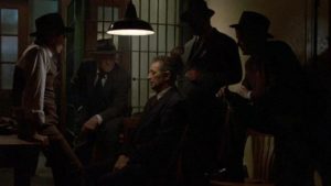 Philip Marlowe (Robert Mitchum) getting the third degree from unfriendly cops in Dick Richards' Farewell, My Lovely (1975)