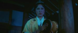 The drum of Melody (Hsu Feng) possesses supernatural power in King Hu's Legend of the Mountain (1979)