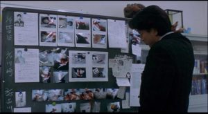 Detective Takebe (Kôji Yakusho) in classic investigator mode in Kiyoshi Kurosawa's Cure (1997)