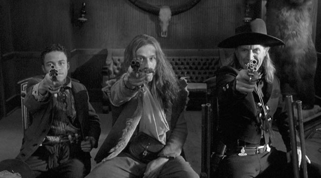 ... while three bounty hunters (Eugene Byrd, Michael Wincott, Lance Henriksen) pursue Blake in Jim Jarmusch's Dead Man (1995)