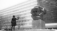 Co-director Petra Epperlein confronts the 40-ton bust of Karl Marx in Chemnitz in Petra Epperlein and Michael Tucker's Karl Marx City (2016)