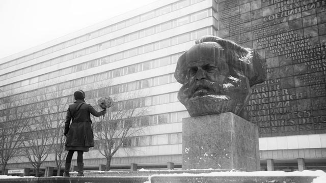 Co-director Petra Epperlein confronts the 40-ton bust of Karl Marx in Chemnitz in Petra Epperlein and Michael Tucker's Karl Marx City (2016)