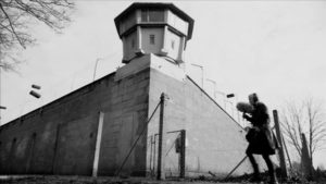 Epperlein outside the Stasi prison in Chemnitz in Petra Epperlein and Michael Tucker's Karl Marx City (2016)