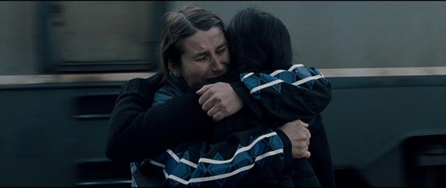 Returning from Germany, Alina (Cristina Flutur) clings desperately to her childhood companion Voichita (Cosmina Stratan) in Cristian Mungiu's Beyond the Hills (2012)