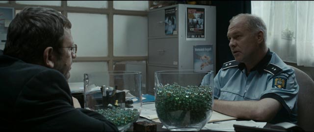 Romeo (Adrian Titieni) gets advice from an old friend, the chief of police (Vlad Ivanov) in Cristian Mungiu's Graduation (2016)