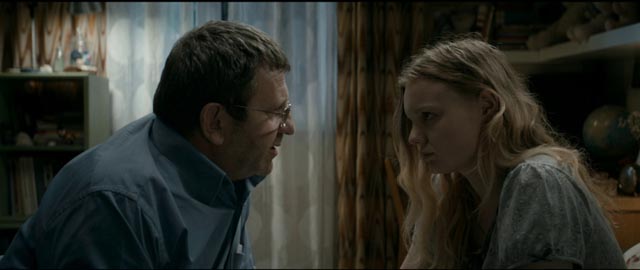 Romeo (Adrian Titieni) tries to explain to Eliza (Maria Dragus) that she must cheat just a little on her exams in Cristian Mungiu's Graduation (2016)