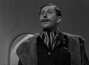 Crewman Bob Trubshaw (Robert Coote) wonders what's delaying Peter's arrival in Heaven in Michael Powell and Emeric Pressburger's A Matter of Life and Death (1946)