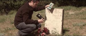 Michael receives messages via various media artifacts in Justin Benson and Aaron Moorhead's Reolution (2012)