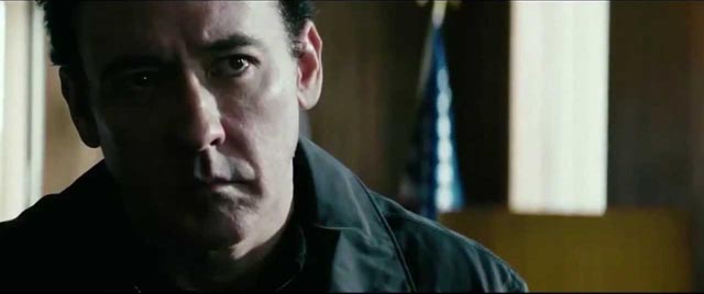 John Cusack as a burnt-out American agent trying to protect a civilian operative in Kasper Barfoed's The Numbers Station (2013)