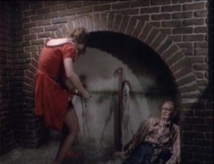 Wendy (Bonnie Beck) faces imminent drowning in an underground trap in D.B. Benedikt's Beyond the Seventh Door (1986)