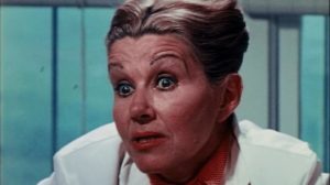 Dr. Geraldine Masters (Anne MacAdams) isn't quite what she seems in S.F. Brownrigg's Don't Look in the Basement (1972)