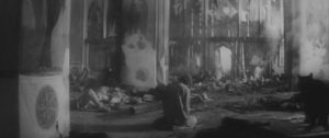 Andrei (Anatoliy Solonitsyn) faces despair inside the cathedral surrounded by the massacred inhabitants of Vladimir in Andrei Tarkovsky's Andrei Rublev (1966)