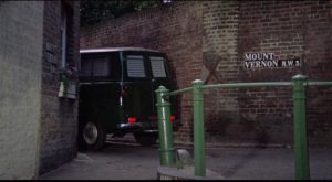 Freddie (Terence Stamp) stalks his prey in an unmarked van in William Wyler's The Collector (1965)