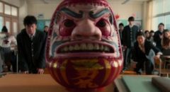 The deadly Daruma doll in the bloody opening scene of Takashi Miike's As the Gods Will (2014)