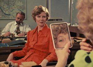 Marion (Hanna Schygulla)'s co-worker Irmgard (Irm Hermann) also disapproves of Jochen (Gottfried John) in Rainer Werner Fassbinder's Eight Hours Don't Make a Day (1972-73)