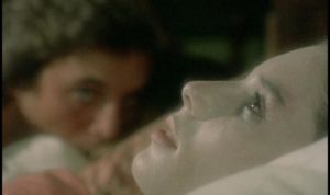 Frank (Kieran Canter) can only get satisfaction making love in view of his dead fiancee in Joe D'Amato's Beyond the Darkness (1979)