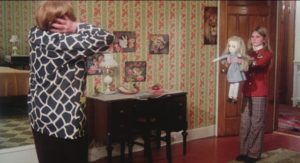 Cathy (Randi Allen) and her doll drive the housekeeper (Dorothy Davis) to her death in Eddy Matalon's Cathy's Curse (1976)