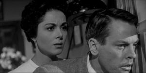 Becky (Dana Wynter) and Miles (Kevin McCarthy) are trapped in Santa Mira, watching the town succumb to the alien takeover in Don Siegel's Invasion of the Body Snatchers (1956)