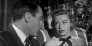 Dr. Miles Bennell (Kevin McCarthy) reassures Wilma (Virginia Christine) that her fears are imaginary in Don Siegel's Invasion of the Body Snatchers (1956)