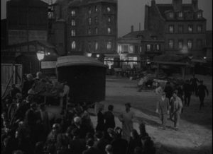 The residents of a Paris neighbourhood rush to see the body of a murdered woman in Julien Duvivier's Panique (1946)