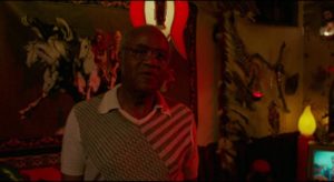 Roebuck "Pops" Staples as Mr. Tucker, a benign practitioner of Voodoo in David Byrne's True Stories (1986)