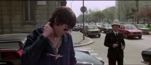 Psychotic Giullio Sacchi (Tomas Milian) prepares to kill a traffic cop in Umberto Lenzi's Almost Human (1974)