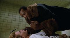 Tony Todd's killer ghost schemes to destroy Helen (Virginia Madsen)'s complacent life so she'll have to join him in Bernard Rose's Clive Barker adaptation Candyman (1992)