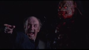 The Verger (Declan O'Brien) becomes a fanatical acolyte of the monster in George Pavlou's Clive Barker adaptation Rawhead Rex (1986)