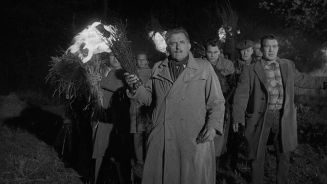 The villagers view the children with horror and form a traditional torch-wielding mob in Wolf Rilla's Village of the Damned (1960)