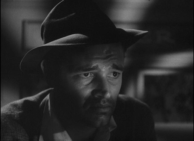 Al Roberts (Tom Neal) contemplates the grim hand he's been handed by Fate in Edgar G. Ulmer's Detour (1946)
