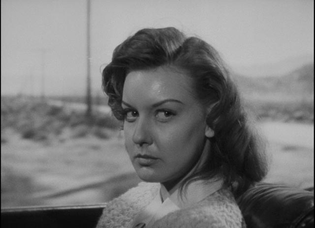 Vera (Ann Savage) knows more about Al (Tom Neal) than he realizes in Edgar G. Ulmer's Detour (1946)