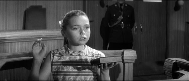 Jean Carter (Janina Faye) takes the stand to testify against the town patriarch in Cyril Frankel's Never Take Sweets from a Stranger (1960)