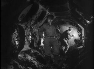 Members of a British Army bomb disposal squad inspect the interior of the alien craft in Nigel Kneale's Quatermass and the Pit (1959)