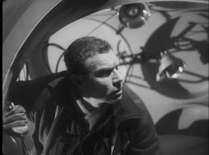 Engineer Sladden (Richard Shaw) begins to revert to an earlier stage of evolution under the ship's influence in Nigel Kneale's Quatermass and the Pit (1959)