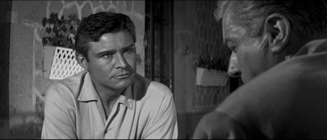 Alan (Ronald Lewis) agrees to seek help from Dr. David Prade (Claude Dauphin) in Val Guest's The Full Treatment (1960)