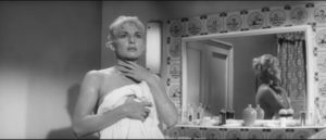 Denise Colby (Diane Cilento) becomes fearful of her husband's radical mood swings in Val Guest's The Full Treatment (1960)