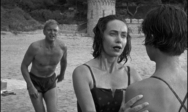 Companion Jean Edwards (Betta St. John) refuses to believe Candy (Mandy Miller)'s accusations against her stepfather (Peter van Eyck) in Guy Green's The Snorkel (1958)