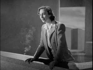 Alice sees a great city emerging from the mists below the tower in Basil Dearden's They Came to a City (1944)