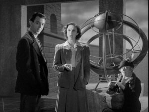 Joe Dinmore (John Clements), Alice (Googie Withers) and Mrs. Barley (Ada Reeve) see a possibility of radical change in Basil Dearden's They Came to a City (1944)