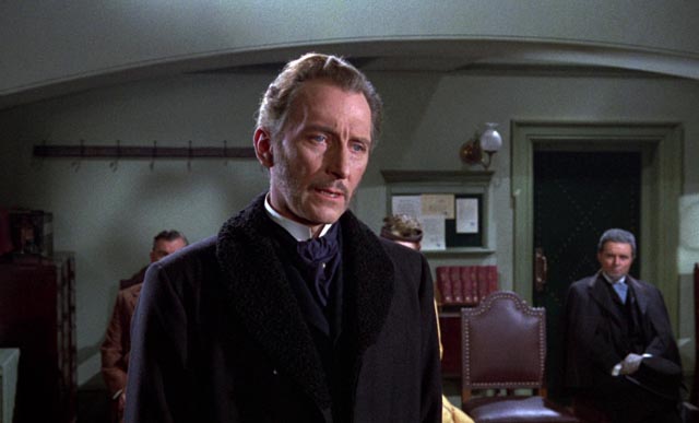 Dr. Namaroff (Peter Cushing) conceals what he knows about the strange deaths plaguing Villandorf in Terence Fisher's The Gorgon (1964)