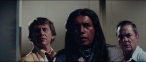 Dr. Hughes (John Cedar), Johns Singing Rock (Michael Ansara) and Harry Erskine (Tony Curtis) get their first look at Misquamacus in William Girdler's The Manitou (1978)