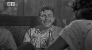 Out of jail, Lonesome (Andy Griffith) turns on the charm to consolidate his hold on Marcia (Patricia Neal) in Elia Kazan's A Face in the Crowd (1957)