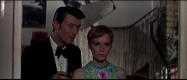 Eberlin (Laurence Harvey) meets photographer Caroline (Mia Farrow) who offers an illusion of a normal life in Amthony Mann's A Dandy in Aspic (1968)